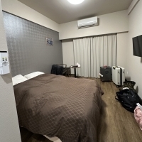 Naha Kume Kinjo LINK Hotel, the rooms are warmly colored and provide a complete 