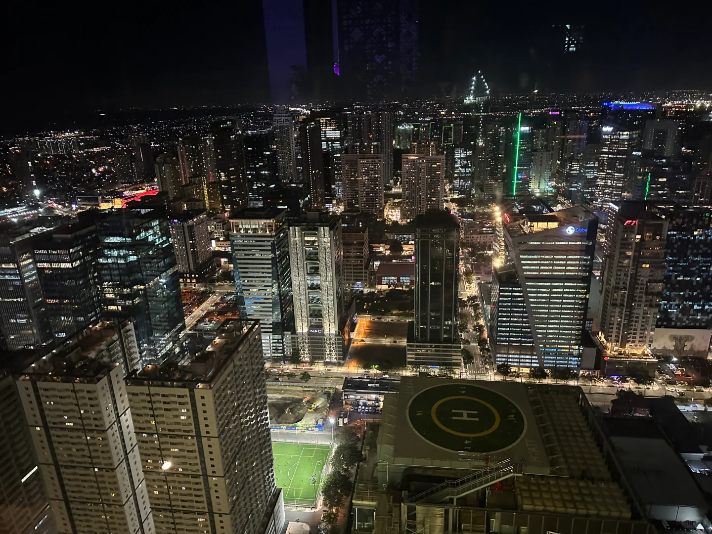 Manila/Luzon-The peak Grand Hyatt Hotel rooftop bar, overlooking the entire BGC city night view