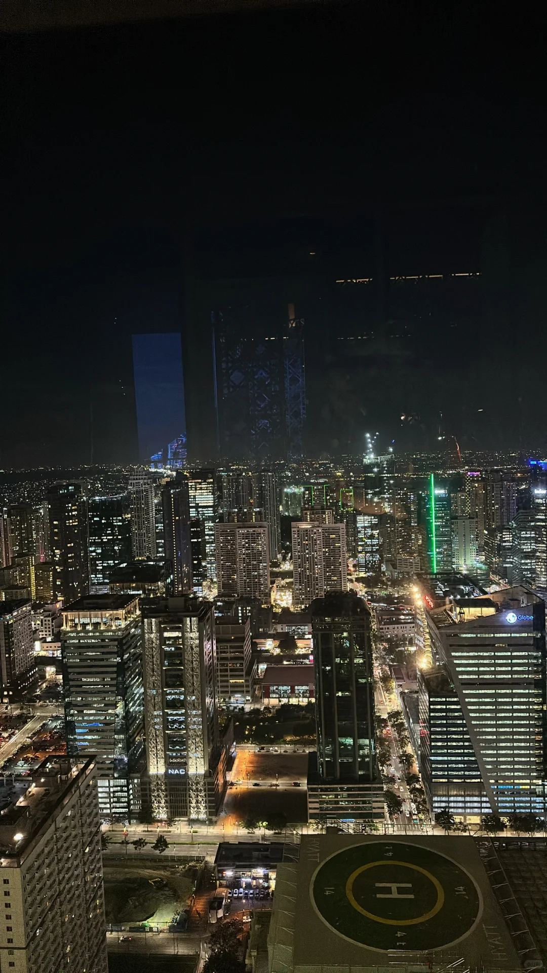 Manila/Luzon-The peak Grand Hyatt Hotel rooftop bar, overlooking the entire BGC city night view