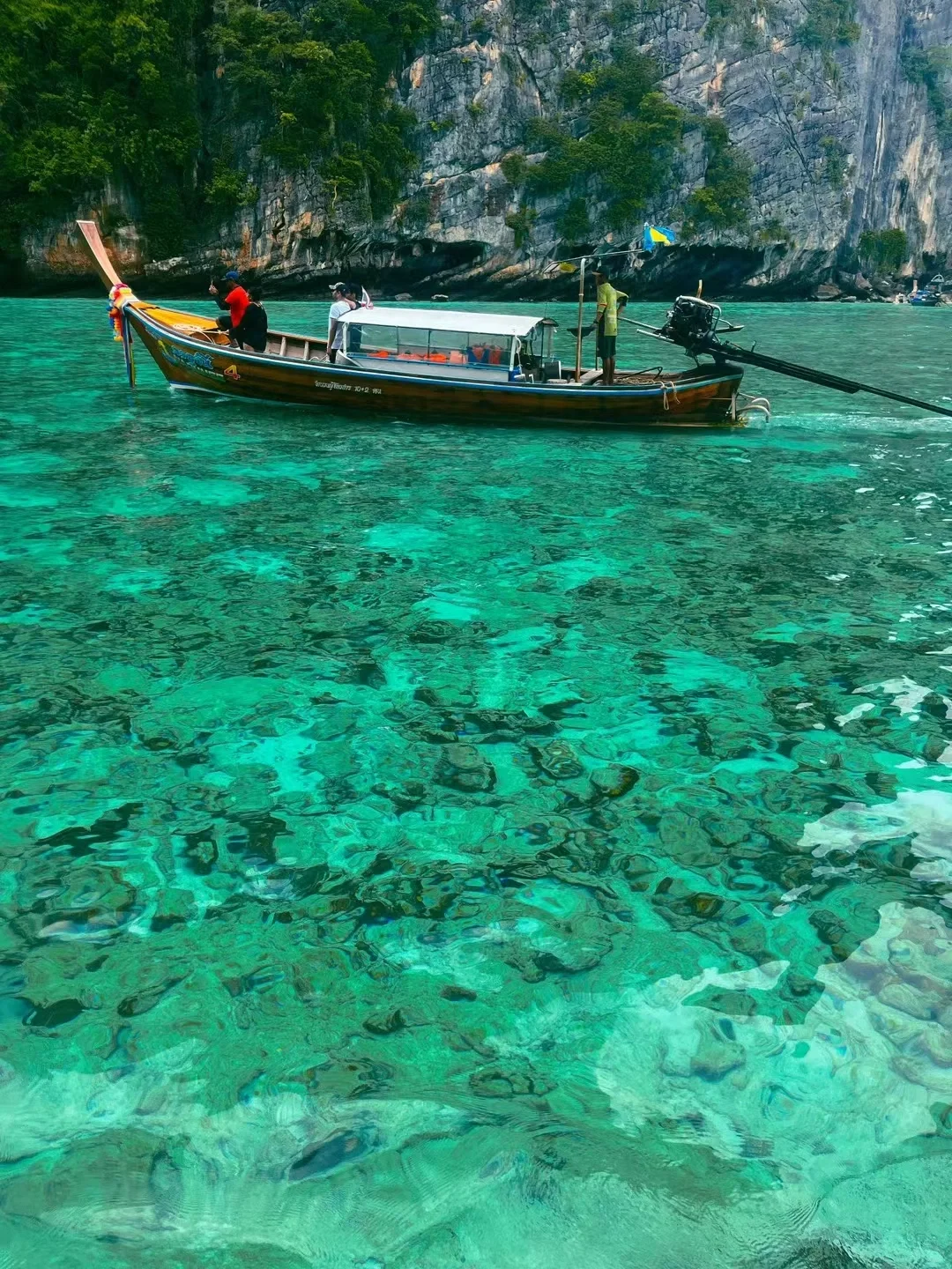 Krabi-Krabi, Thailand, looking at the glass-like transparent sea water