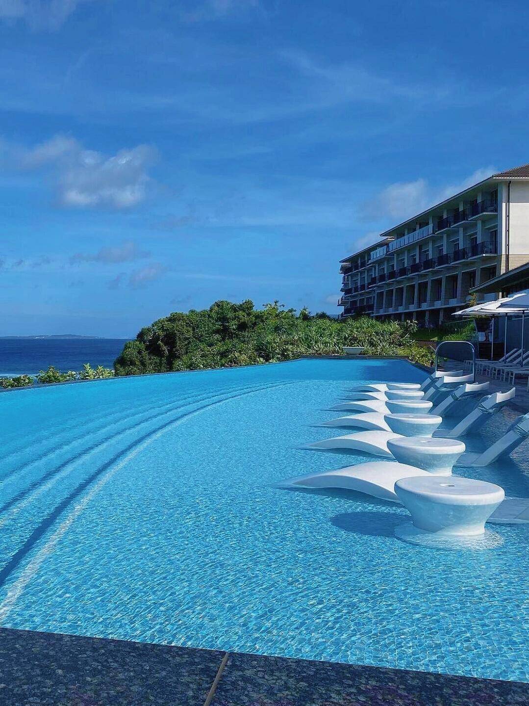 Okinawa-Halekulani Hotel in Okinawa?, surrounded by white sandy beaches and lush greenery