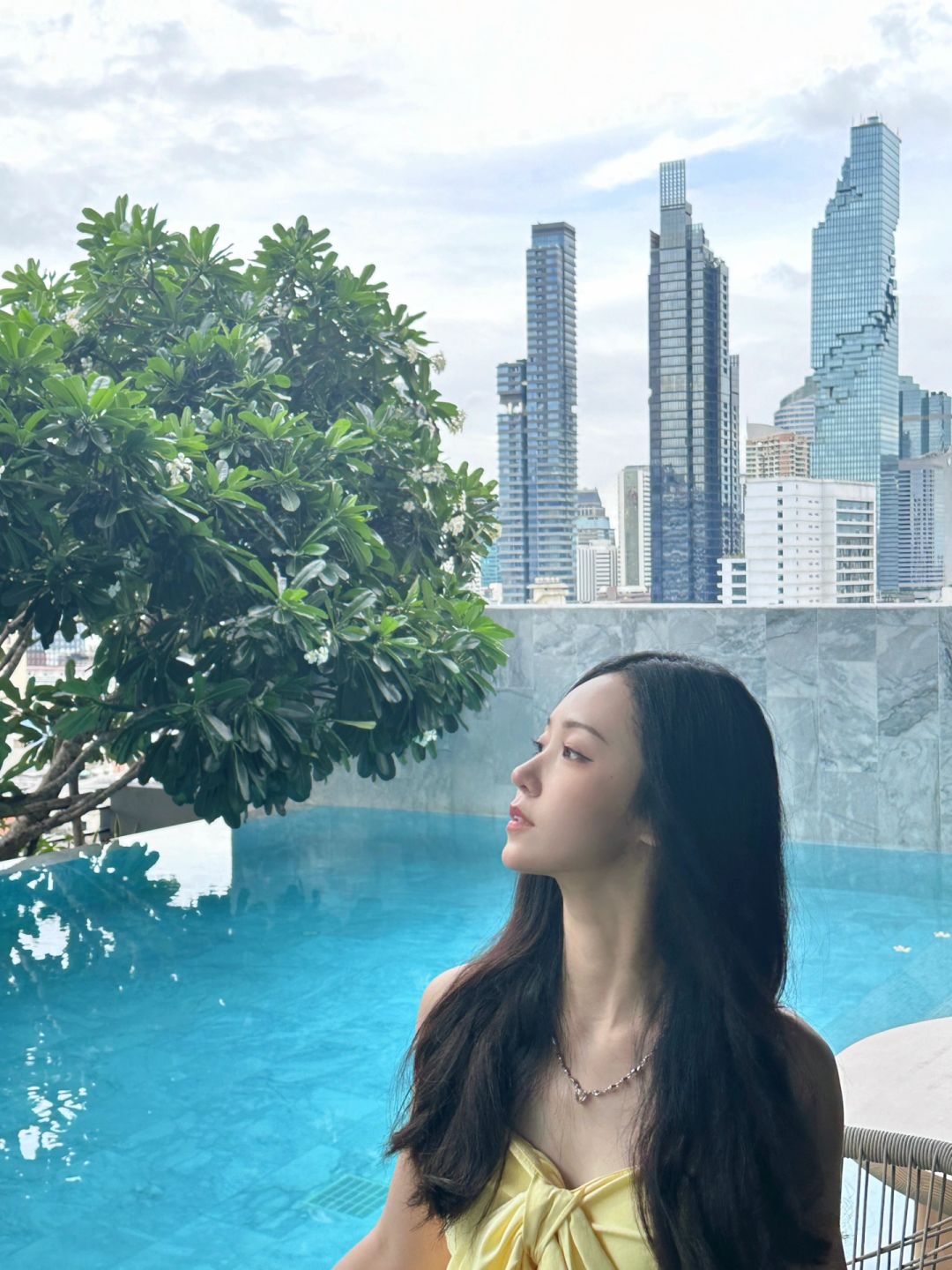 Bangkok-DusitD2 Bangkok Hotel, you can take a photo of the Pixel Building in the indoor swimming pool