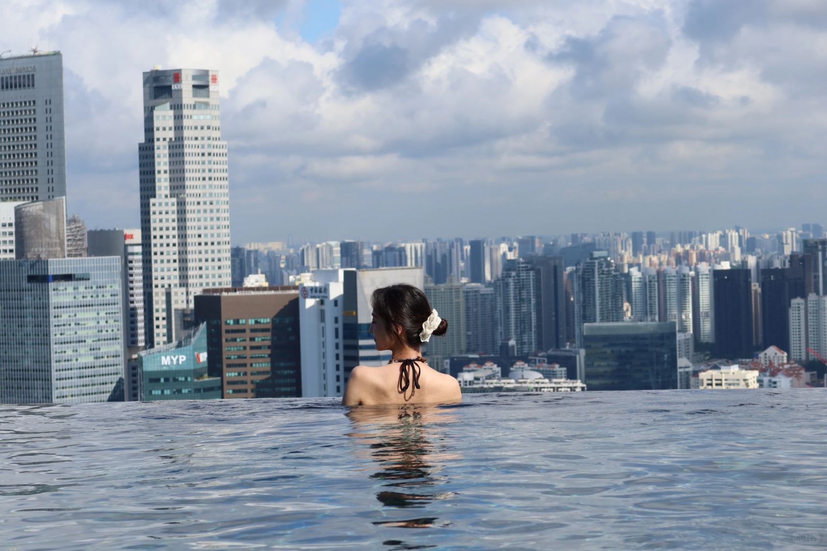 Singapore-The infinity pool on the rooftop of the Golden Sands Hotel, with views of the Gardens by the Bay and the light show