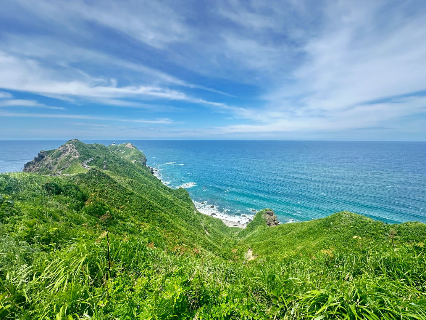 Sapporo/Hokkaido-Summer is the right way to start your trip to Hokkaido?, with green grass and blue sea