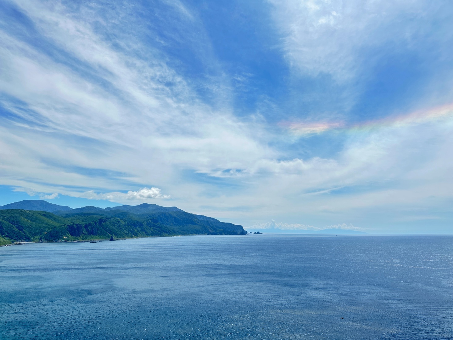 Sapporo/Hokkaido-Summer is the right way to start your trip to Hokkaido?, with green grass and blue sea