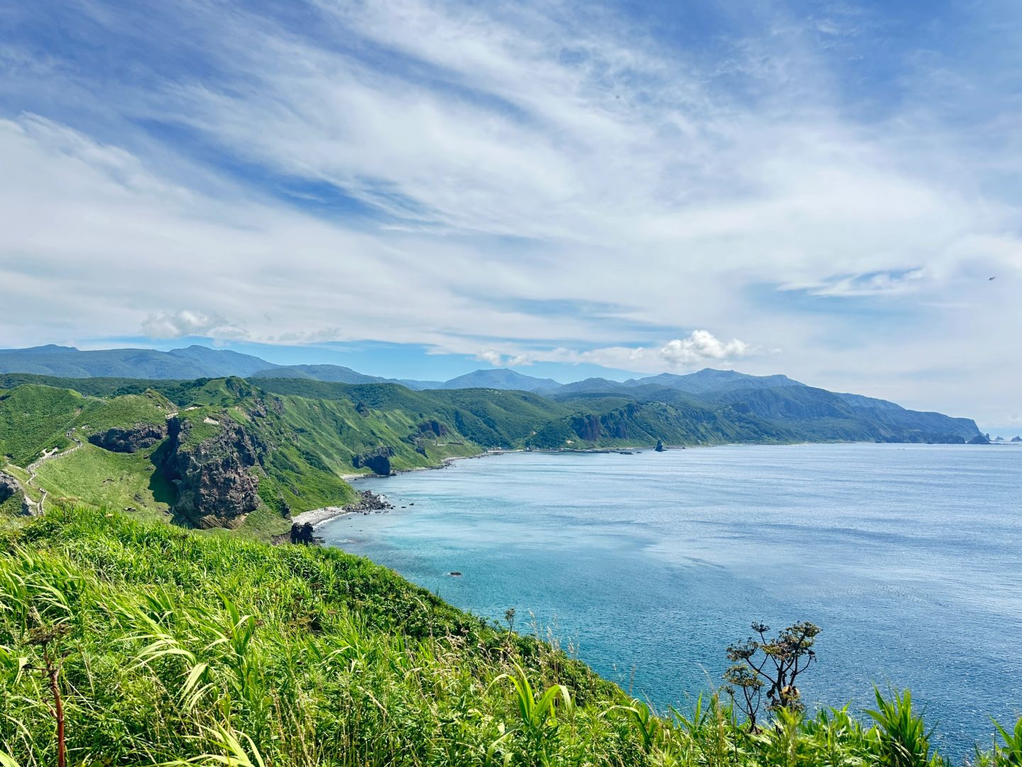 Sapporo/Hokkaido-Summer is the right way to start your trip to Hokkaido?, with green grass and blue sea