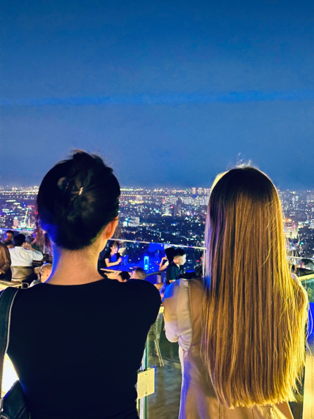 Hanoi-Top Of Hanoi Bar, the highest sky-high open-air bar in Hanoi, 2 girls drinking together