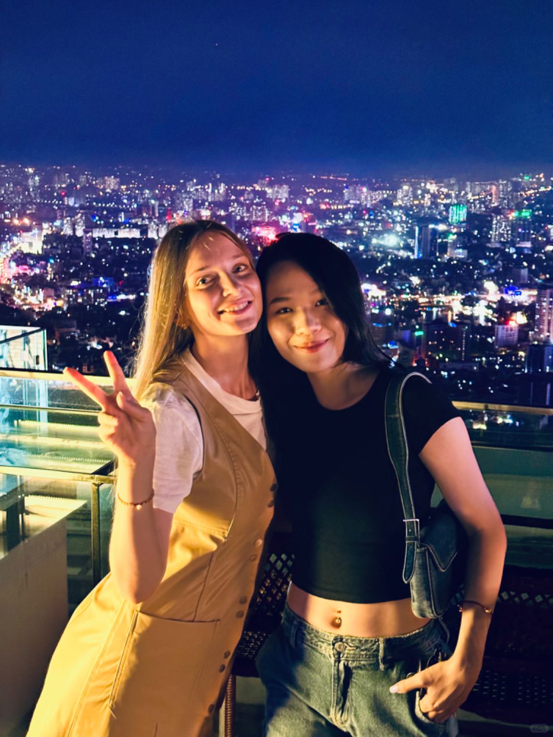 Hanoi-Top Of Hanoi Bar, the highest sky-high open-air bar in Hanoi, 2 girls drinking together