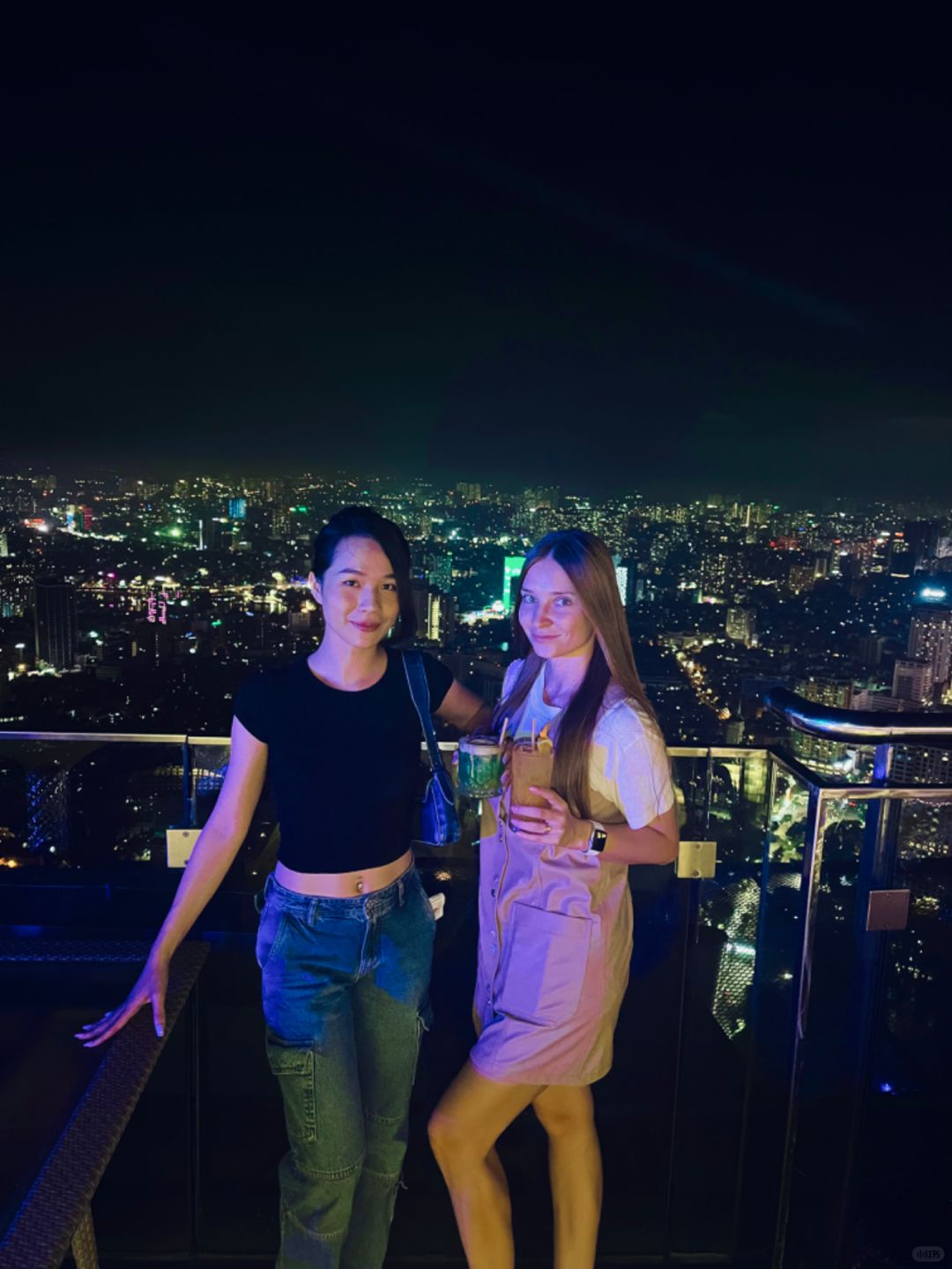 Hanoi-Top Of Hanoi Bar, the highest sky-high open-air bar in Hanoi, 2 girls drinking together