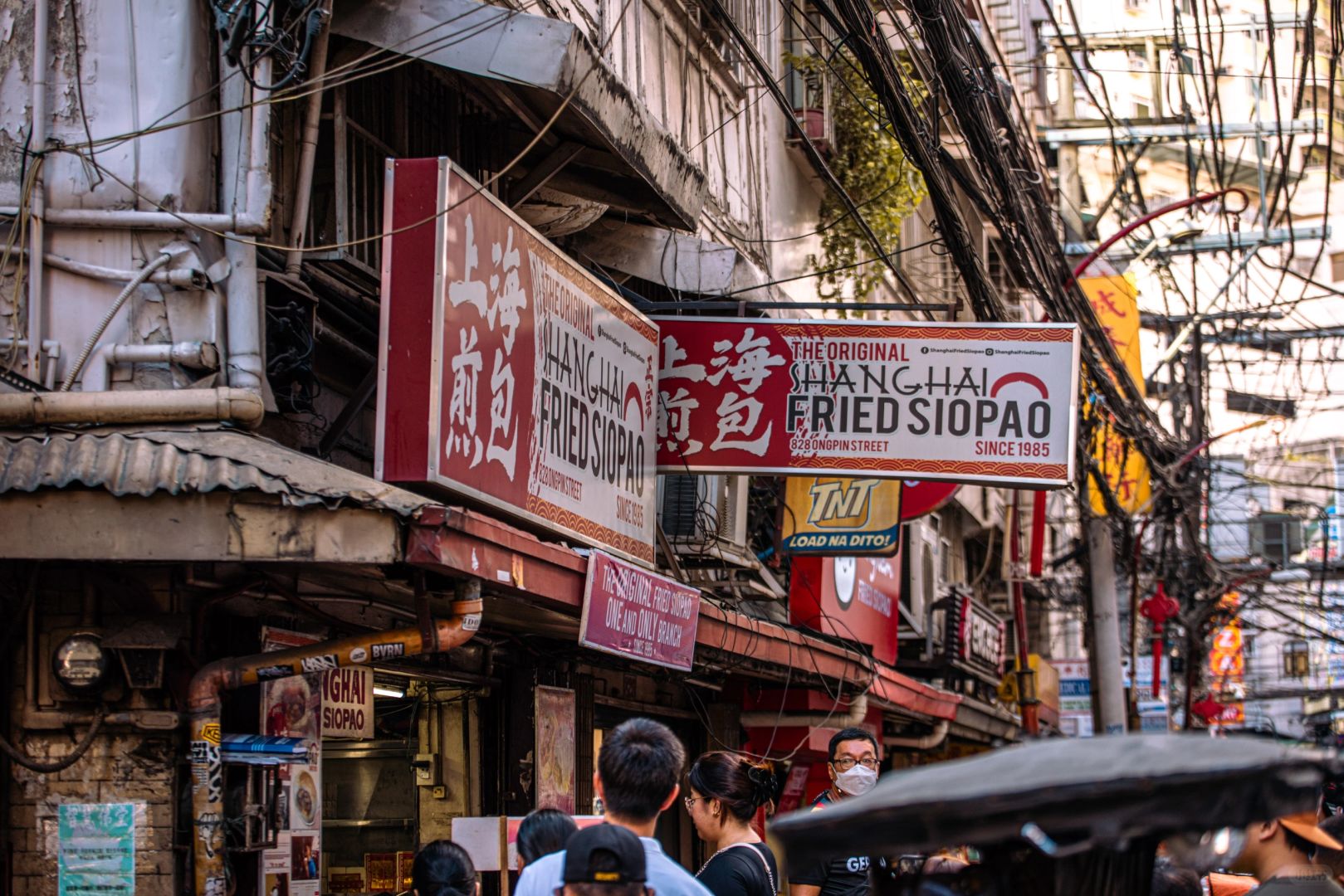 Manila/Luzon-Visiting Chinatown in Manila, Philippines. Noisy, messy, lively, crowded. Very lively