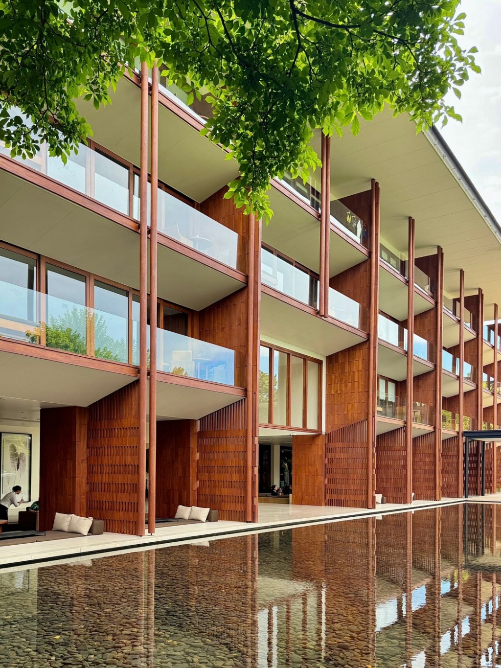 Chiang Mai-Anantara Chiang Mai Hotel Resort, designed by Kerry Hill, sunbathing and reading by the pool