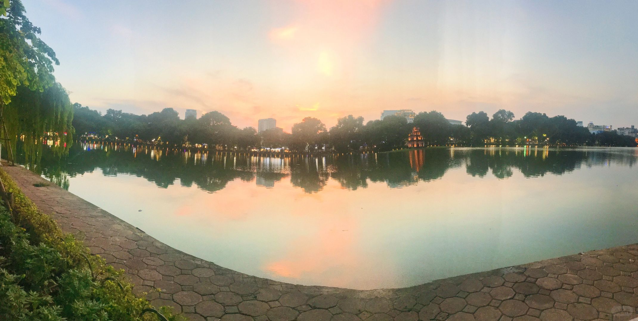 Hanoi-Hoan Kiem Lake Park in Hanoi, Vietnam, the lake is as clear mirror and the trees are lush