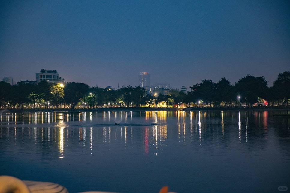 Hanoi-The Sipping Bar, a treasured café in Hanoi's Treasure Park, is a glass house surrounded by lake views