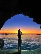 Lambros Point, a small cave shooting point, orange tenderness at sunset