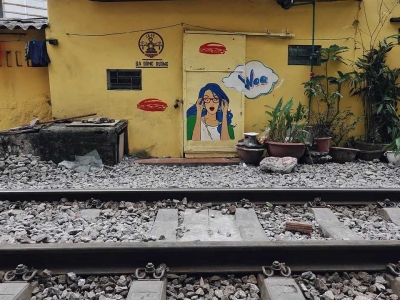 Railway travel in Hanoi: a popular railway and a steel bridge